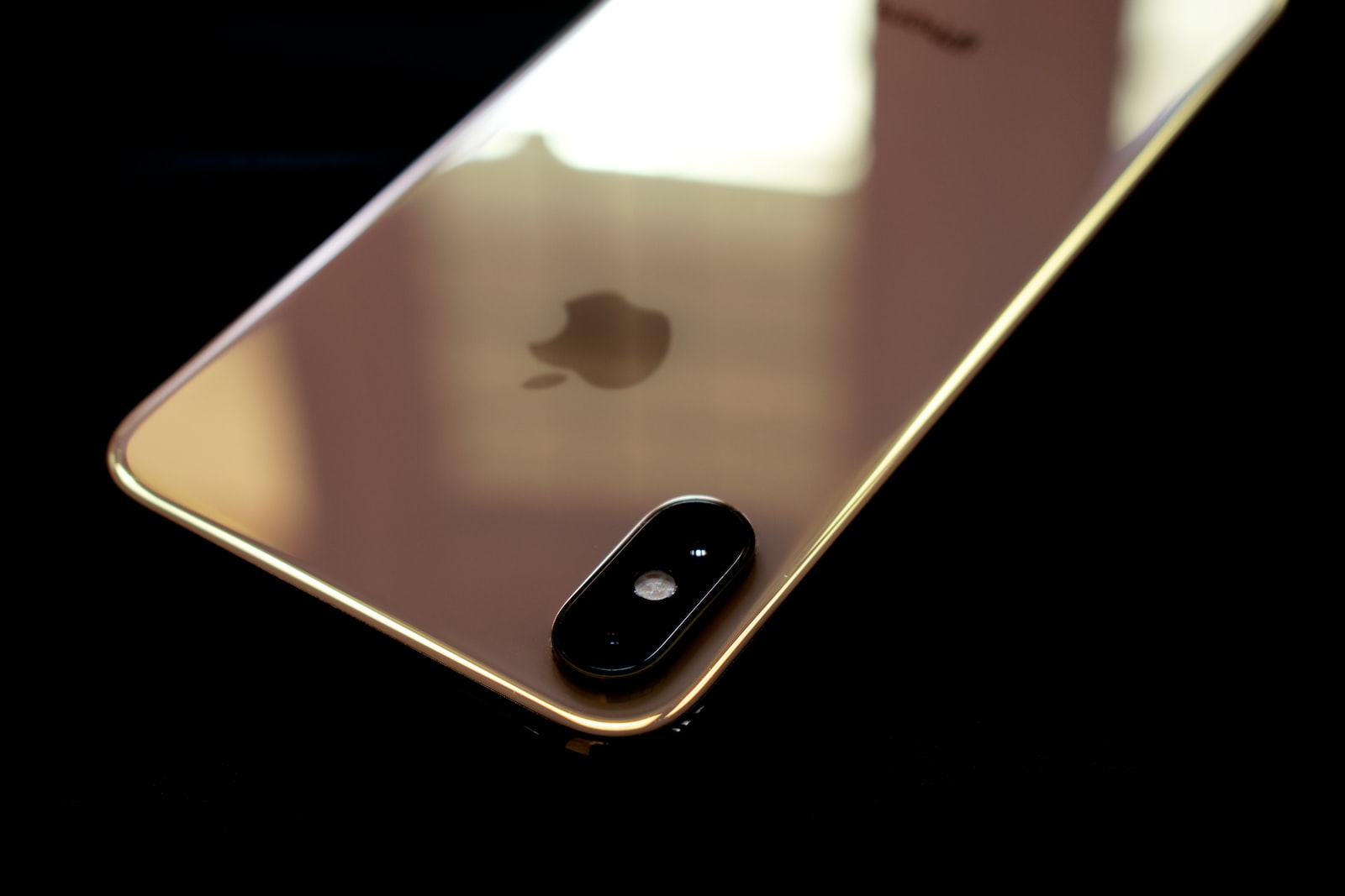 black iphone 4 on orange surface